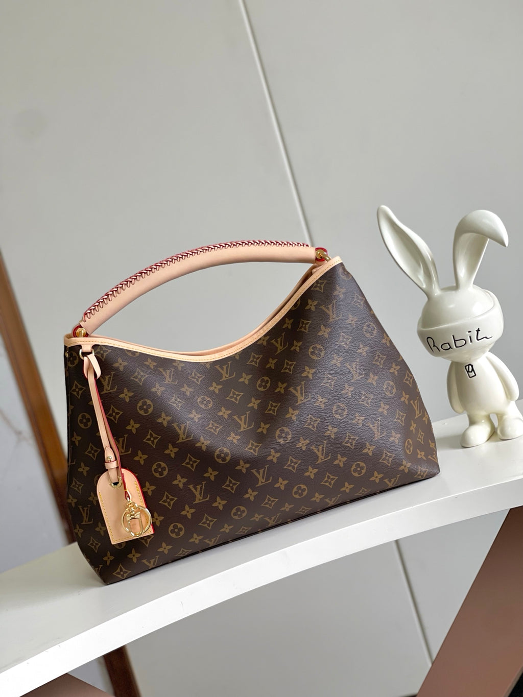 Again Handbag with a classic Monogram canvas base