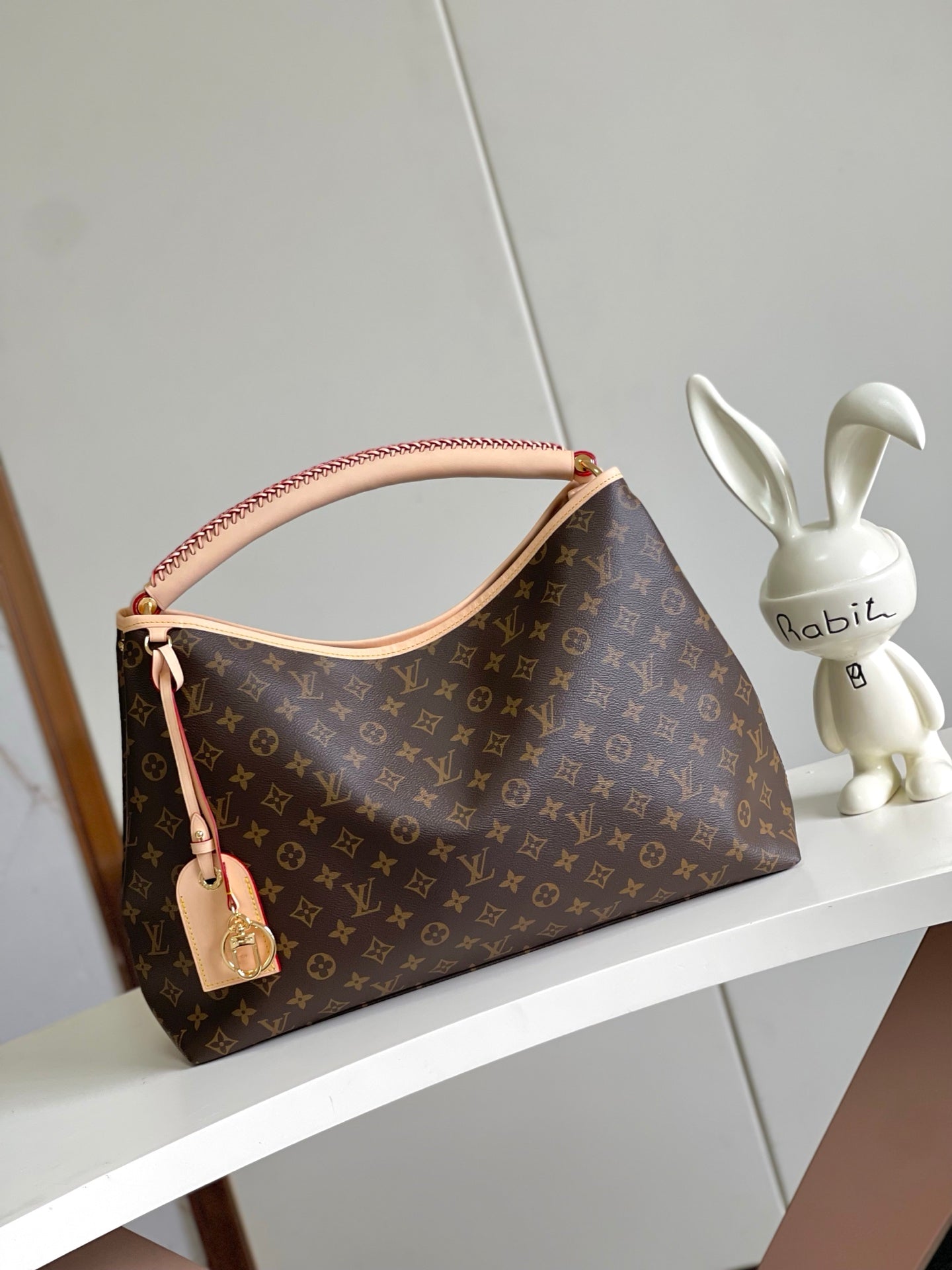 Again Handbag with a classic Monogram canvas base