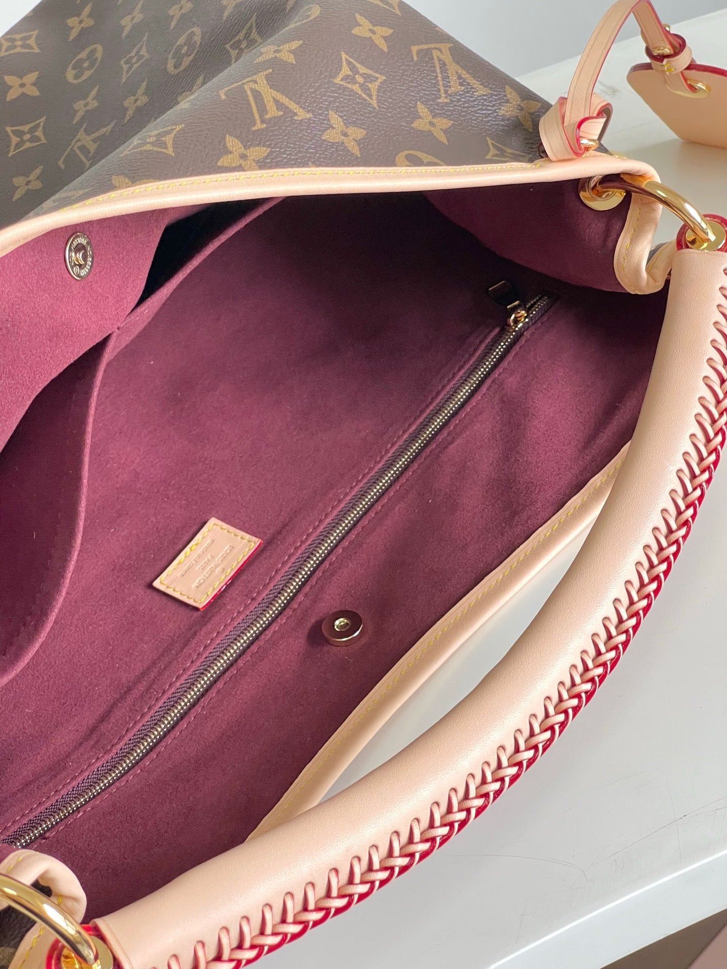 Again Handbag with a classic Monogram canvas base